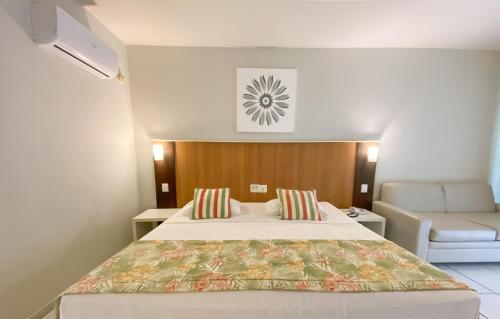 Postel nebo postele na pokoji v ubytování Búzios Beach Resort