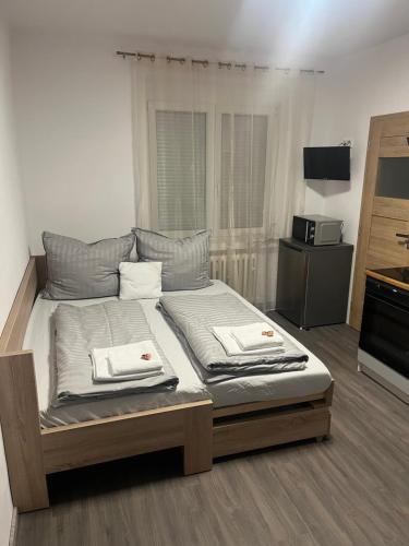 Giường trong phòng chung tại Apartman Riegrova 41