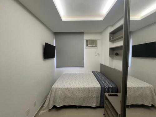 Ένα ή περισσότερα κρεβάτια σε δωμάτιο στο Vita Residencial Clube - Flat 3 Quartos por Yolo