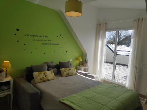 Ένα ή περισσότερα κρεβάτια σε δωμάτιο στο Au clos du pont, appartement relax