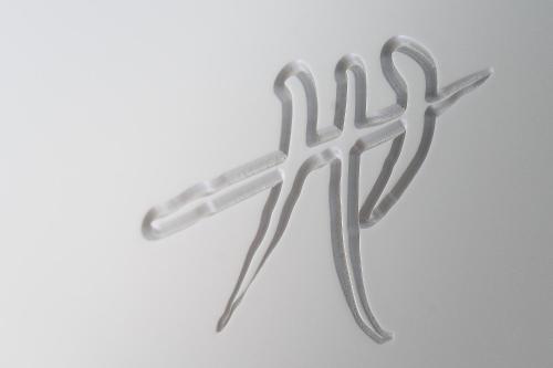 a pair of metal scissors on a white background at Hellstens Glashus in Stockholm