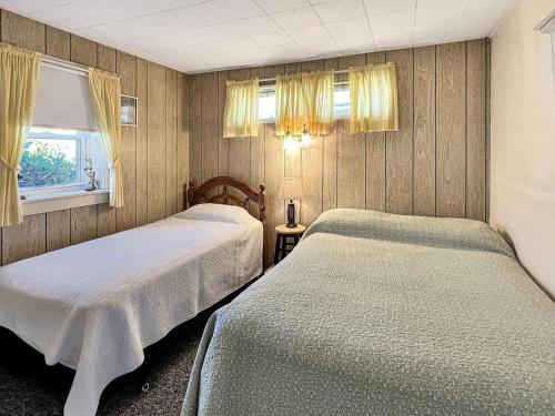 Postel nebo postele na pokoji v ubytování Twin Sails