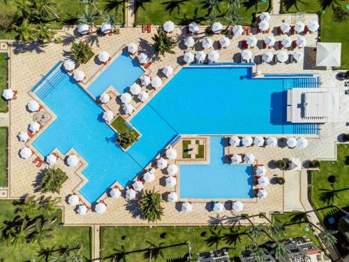 an overhead view of a pool at a resort at Rixos Sharm El Sheikh - Adults Only 18 Plus in Sharm El Sheikh
