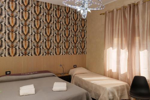 Giường trong phòng chung tại BeB Imperial