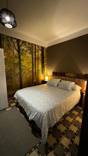 a bedroom with a bed and a large window at Apartamento felicitat in Figueres
