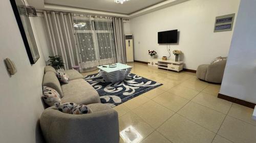 Μια τηλεόραση ή/και κέντρο ψυχαγωγίας στο Masaki H and Apartment