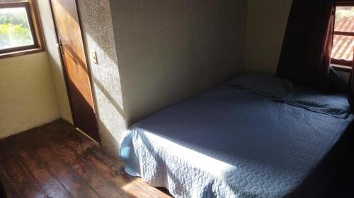 En eller flere senge i et værelse på Casa 11 Condomínio Completo 4qts