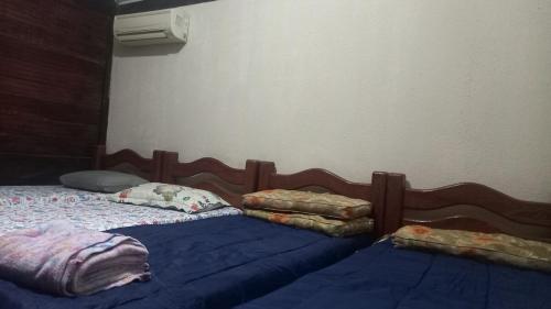 En eller flere senge i et værelse på Casa 11 Condomínio Completo 4qts