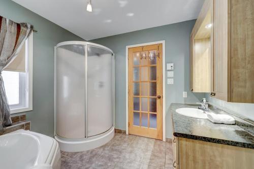 a bathroom with a shower and a toilet and a sink at The Dreamer - Skiing - Spa - Outdoor and Relaxation in Petite-Rivière-Saint-François