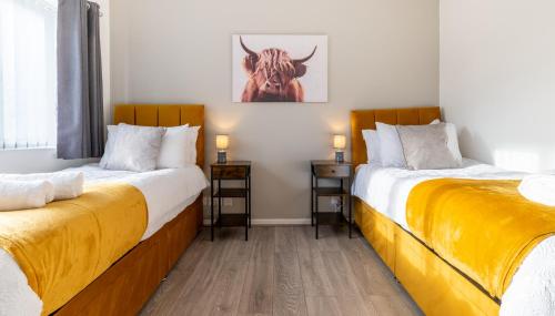 Voodi või voodid majutusasutuse Headingley Lodge - Modern Home Near City Centre Perfect For Contractors toas