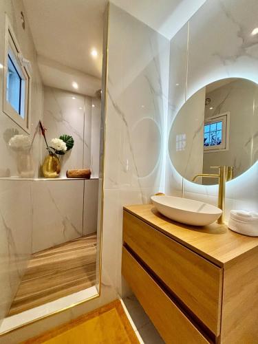 a bathroom with a sink and a mirror at Villa Princess sea view private pool Anse Marcel in Saint Martin