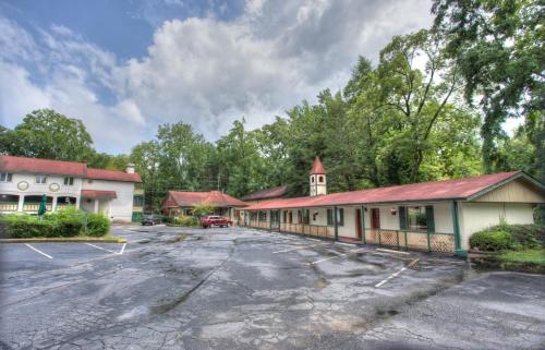 an empty parking lot in front of a building at Hofbrau Riverfront Hotel in Helen