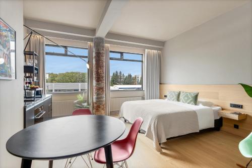 Voodi või voodid majutusasutuse Arctic Comfort Hotel toas