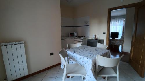 a kitchen and dining room with a table and chairs at Tempio del Sole in Terni