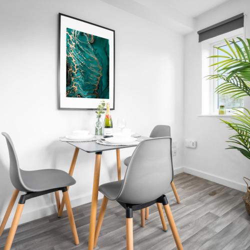a dining room with a table and chairs at Modern 2 Bed Apartment - Sleeps 3 - Netflix - Parking 55C in Sleightholme