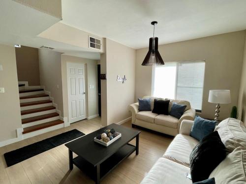 a living room with a couch and a table at Casa Sendero in Senecú