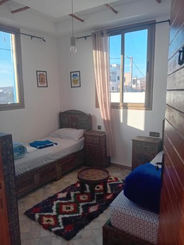 Ένα ή περισσότερα κρεβάτια σε δωμάτιο στο Villa azzurra imsouane