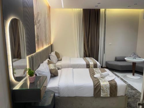 Ένα ή περισσότερα κρεβάτια σε δωμάτιο στο Atlantis Hotel