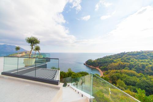 a house with a view of the ocean at Villas Vita & Dola in Budva