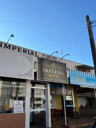 a sign for an imperial hotel on a street at Hotel Imperial in Toledo