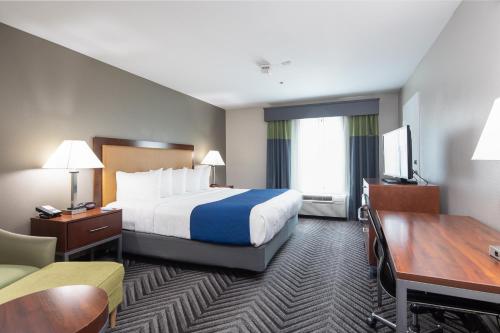 a hotel room with a bed and a desk at Best Western Inn & Suites San Mateo - San Francisco Airport in San Mateo