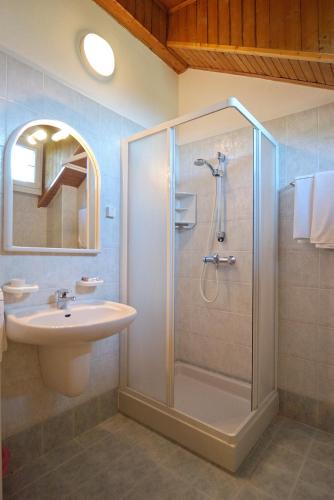 a bathroom with a shower and a sink at Hotel Karinhall in Trento