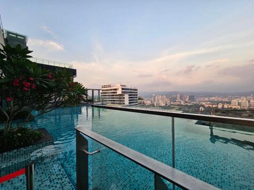 a large swimming pool on top of a building at Panorama luxury Suites At TM Persiaran Stonor KLCC in Kuala Lumpur