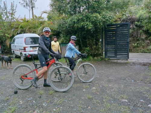 a group of people on bikes in a parking lot at Glamping Tierra Dulce in Supatá