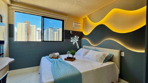 Ένα ή περισσότερα κρεβάτια σε δωμάτιο στο (507) Studio tropical Perto da Praia