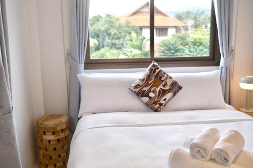 Postel nebo postele na pokoji v ubytování Little Sand Fisherman's Village