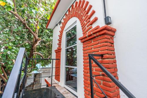 a brick window on the side of a building at Apartment in Convention Center, Oaxaca in Oaxaca City