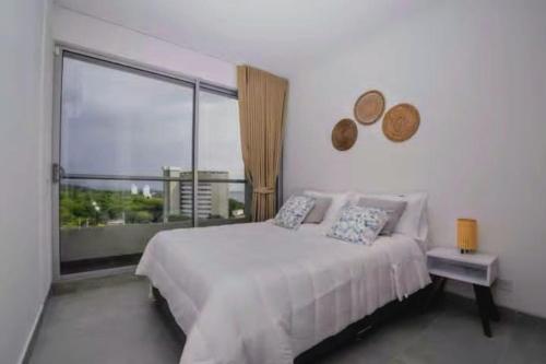 Postel nebo postele na pokoji v ubytování Santa Marta apartamento con vista al mar- santamarina-709