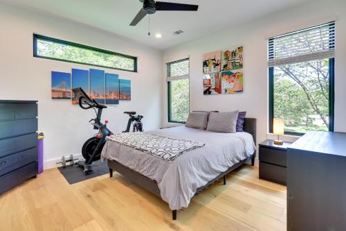 a bedroom with a bed and a bike in it at Chic Austin House with Spacious Backyard and Hammock in Austin