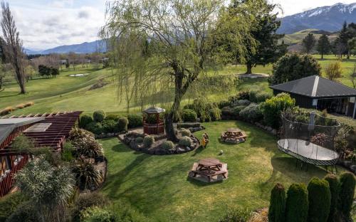 an aerial view of a garden with a gazebo at Alpine Springs Motel in Hanmer Springs