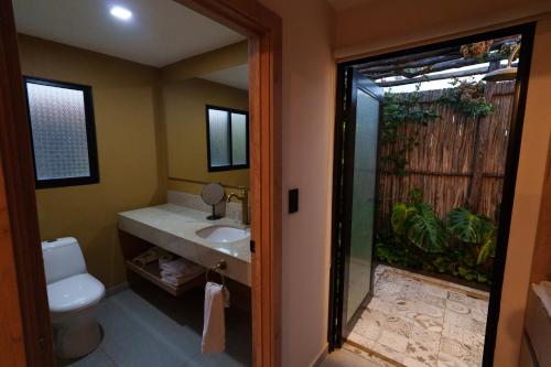 a bathroom with a toilet and a sink and a shower at GUAJIRA CASA DEL MAR in Ríohacha
