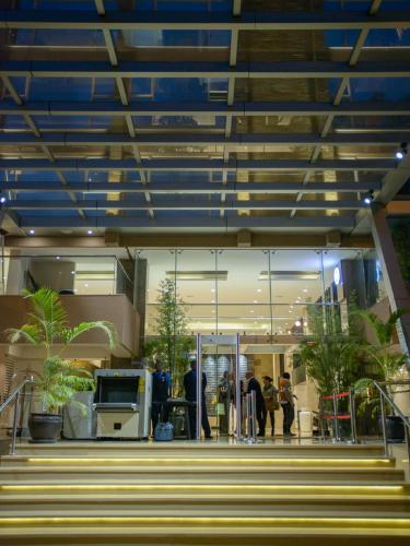 a lobby of a building with people standing in it at The Concord Hotel & Suites in Nairobi