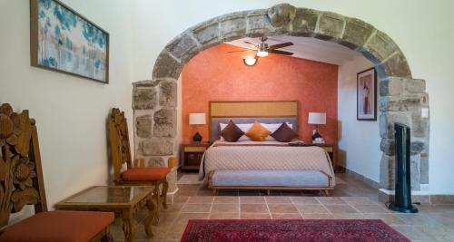 Ένα ή περισσότερα κρεβάτια σε δωμάτιο στο La Buena Vibra Wellness Resort & Spa