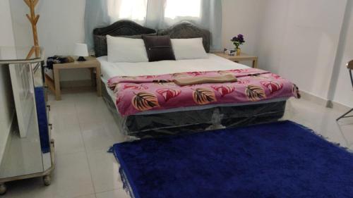 Ένα ή περισσότερα κρεβάτια σε δωμάτιο στο BaitAlhoor GardenHostel