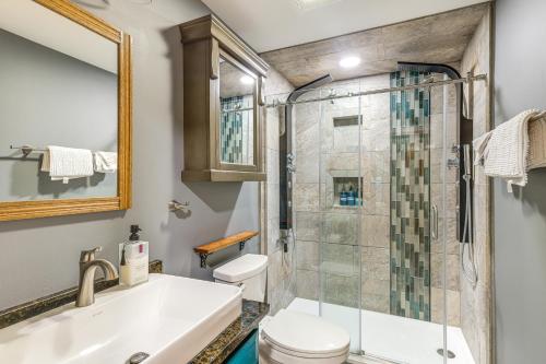 a bathroom with a shower and a toilet and a sink at 9 Mi to Hickory Ski Center Wooded Warrensburg Gem in Bolton