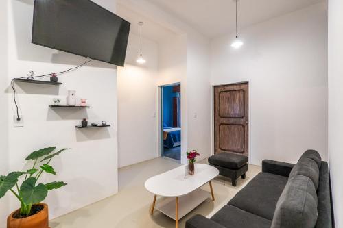 a living room with a couch and a table at Apartment in Convention Center, Oaxaca in Oaxaca City