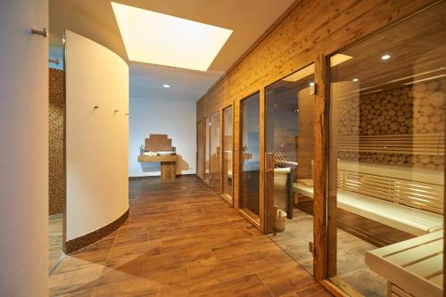 a corridor of a wine tasting room with wooden walls at Hotel Schwaiger in Eben im Pongau