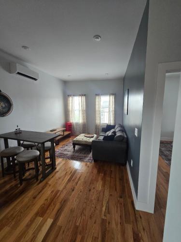 a living room with a couch and a table at The Harrison in Harrison