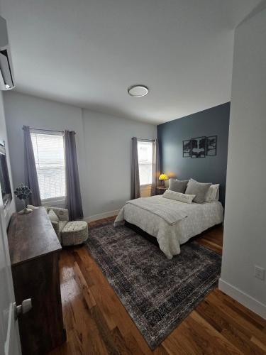 a bedroom with a bed and a rug at The Harrison in Harrison