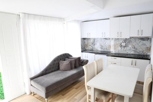 a living room with a couch and a table at The Central Spot in Tirana