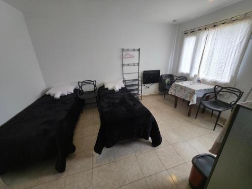 Ένα ή περισσότερα κρεβάτια σε δωμάτιο στο Aparts Valentyna El Chalten 2