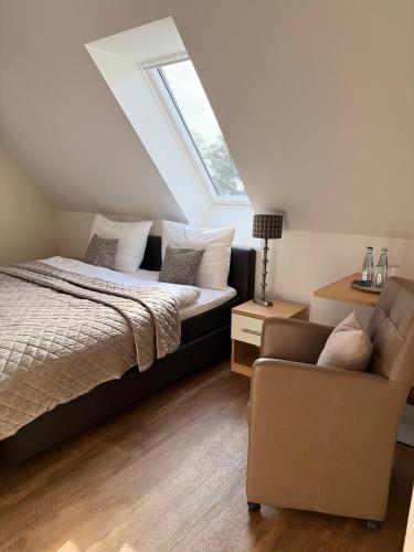 Postel nebo postele na pokoji v ubytování Dat Lütte Hus