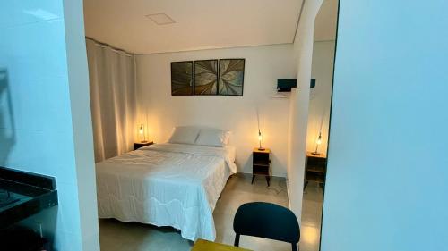 Un pat sau paturi într-o cameră la Hospedaria Central