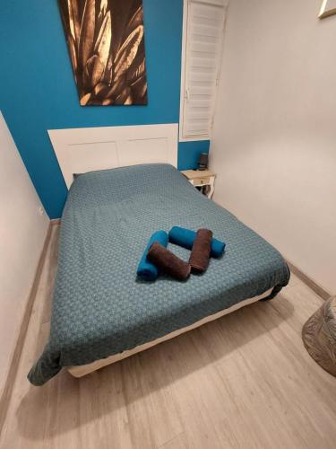 Ένα ή περισσότερα κρεβάτια σε δωμάτιο στο Le Mistral location