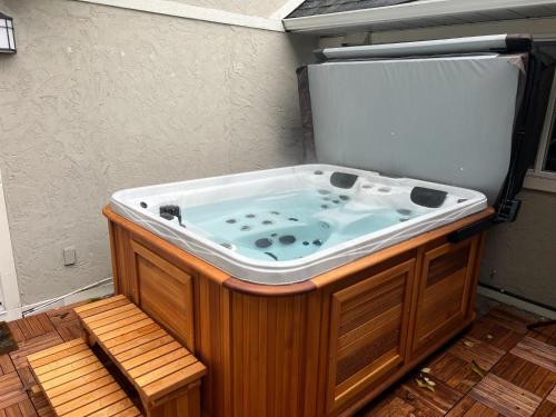 a jacuzzi tub in the corner of a room at Five Gables B&B in Qualicum Beach