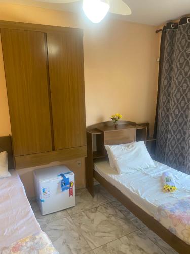 Un ou plusieurs lits dans un hébergement de l'établissement Pousada e Restaurante Toca do Camarão Gourmet